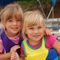Two Young Girl Toddlers with life jackets boating